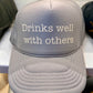 Drinks well with others Trucker Hat